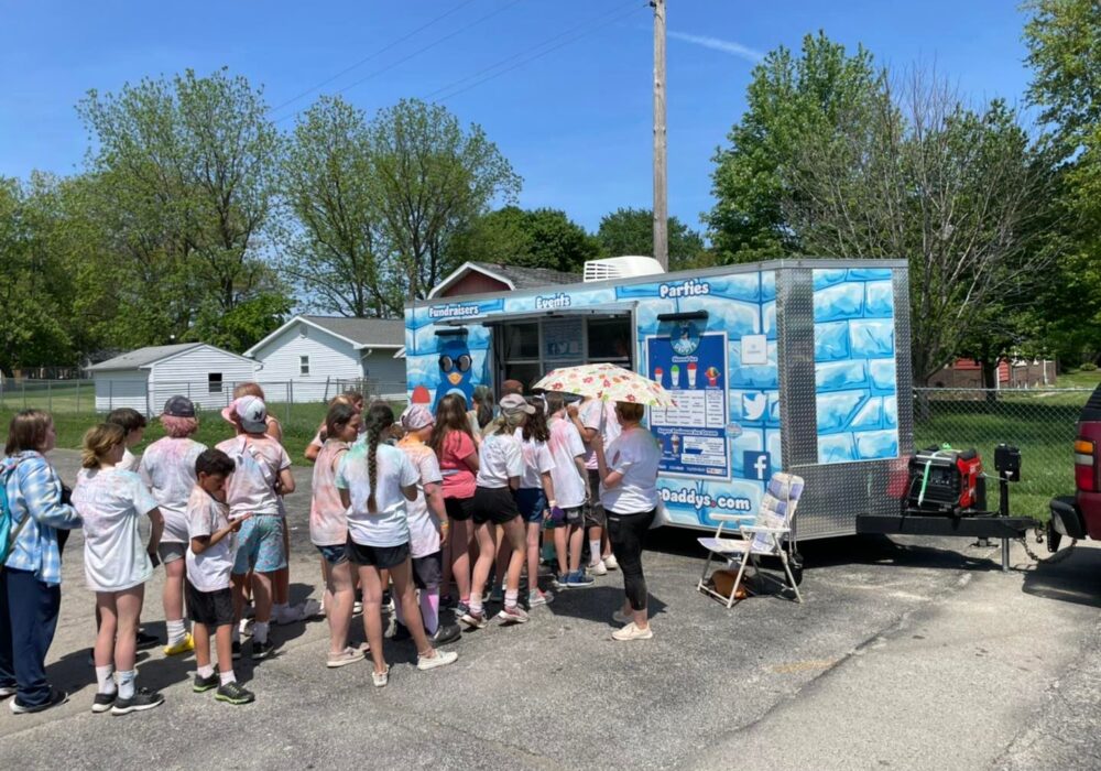 Kids Lined up at food truck at party for Shaved ice and Ice cream